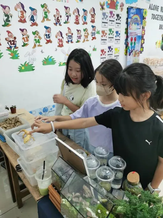 Children at a terrarium table
