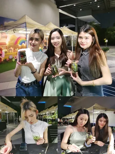 Guests showing the terrariums they made