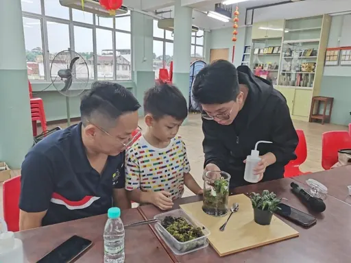 A father and child building together