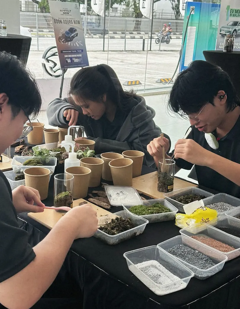 Students working at a terrarium workshop table
