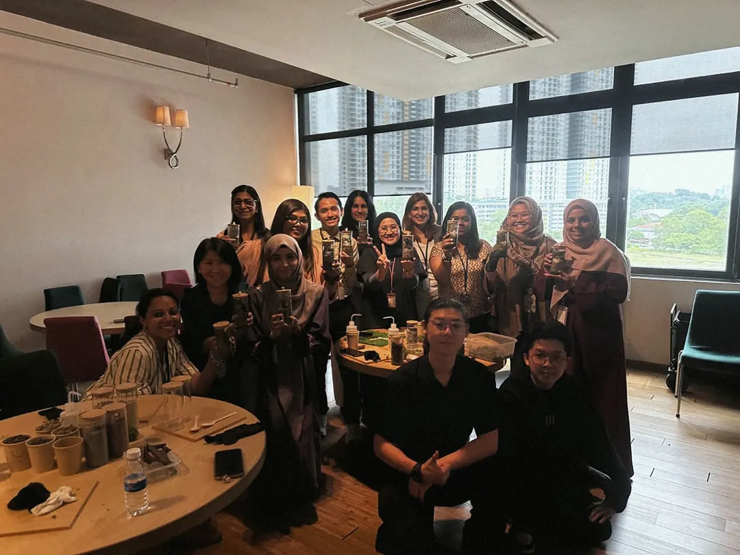 A workshop group gathered in a function room